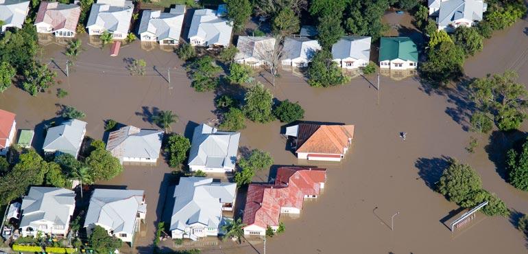 topical view od houses in a flood