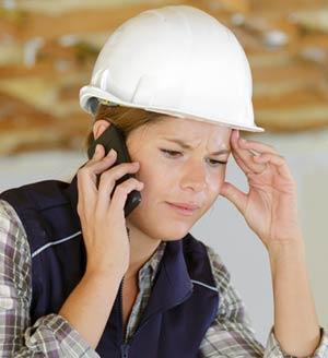 Woman on phone in hardhat